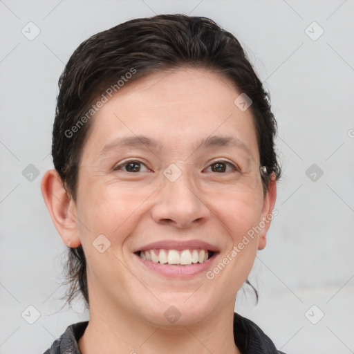 Joyful white adult female with medium  brown hair and brown eyes