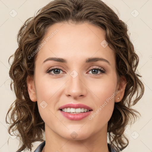 Joyful white young-adult female with medium  brown hair and green eyes