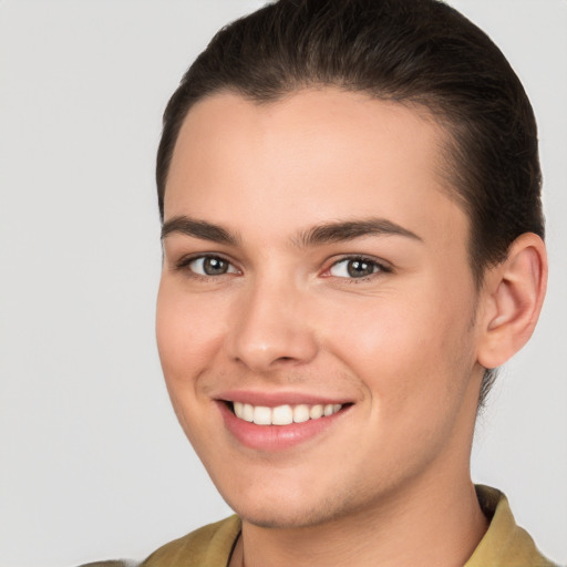 Joyful white young-adult female with short  brown hair and brown eyes