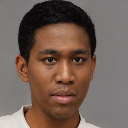 Neutral black young-adult male with short  black hair and brown eyes