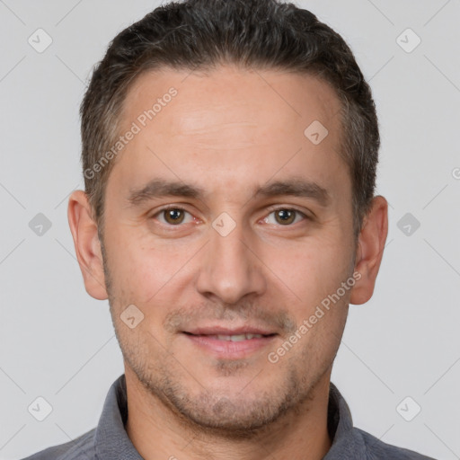 Joyful white adult male with short  brown hair and brown eyes