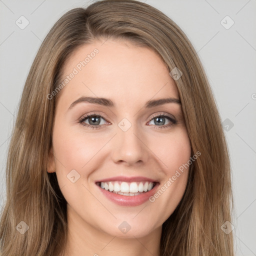 Joyful white young-adult female with long  brown hair and green eyes