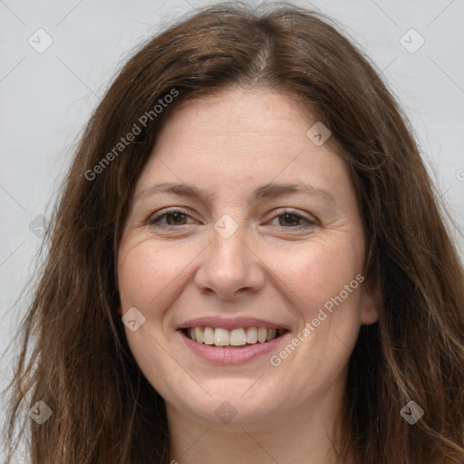 Joyful white adult female with long  brown hair and brown eyes