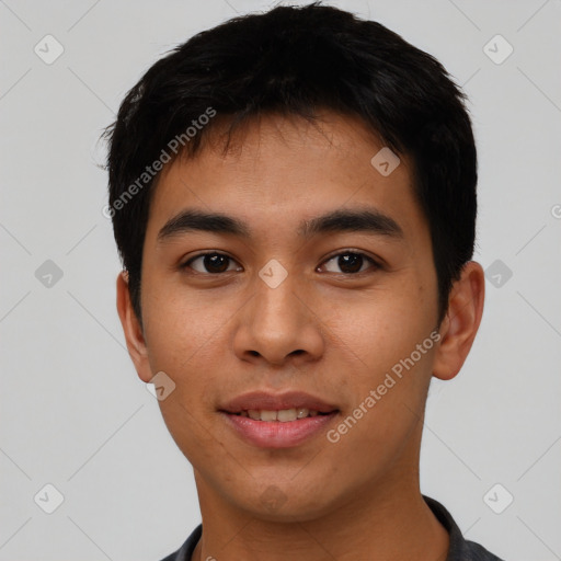 Joyful asian young-adult male with short  black hair and brown eyes