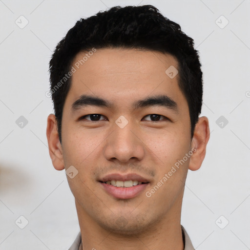 Joyful asian young-adult male with short  black hair and brown eyes