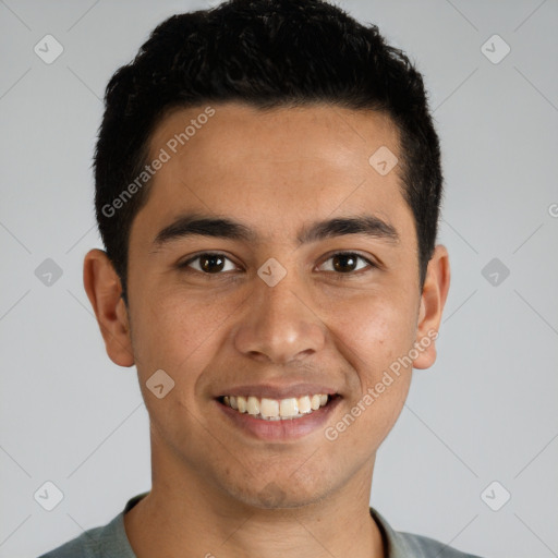 Joyful white young-adult male with short  black hair and brown eyes