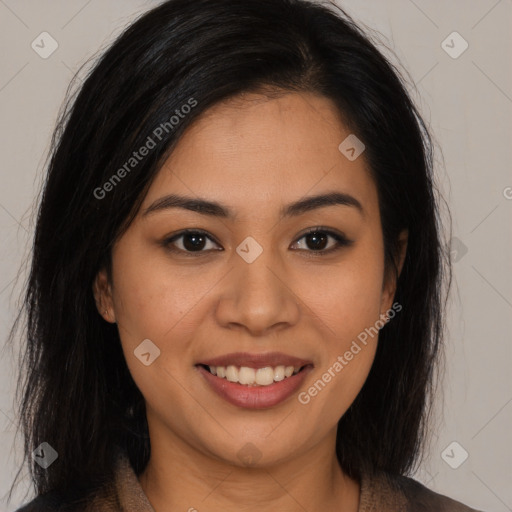 Joyful latino young-adult female with medium  brown hair and brown eyes