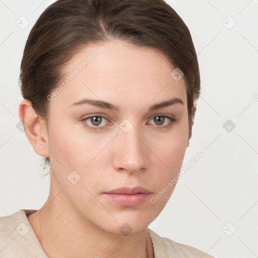 Neutral white young-adult female with short  brown hair and brown eyes