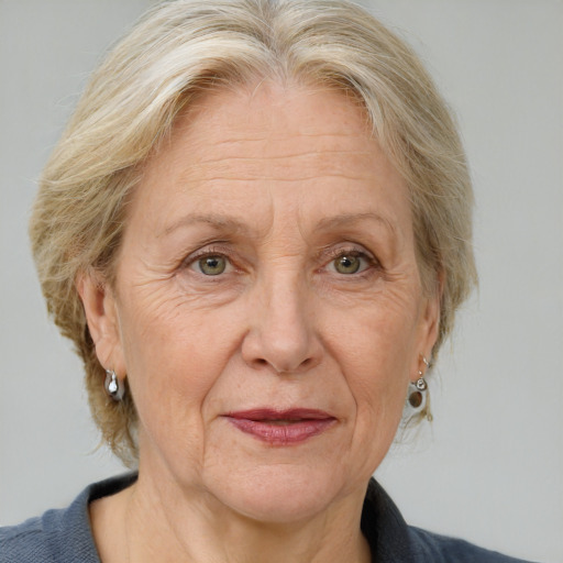 Joyful white middle-aged female with medium  brown hair and blue eyes