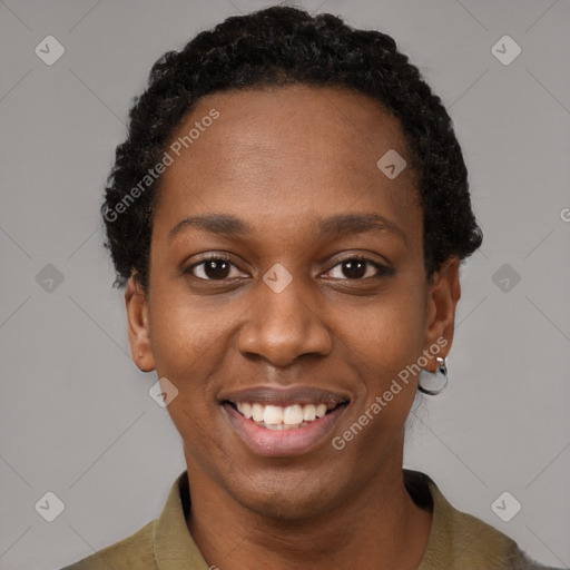 Joyful black young-adult female with short  black hair and brown eyes