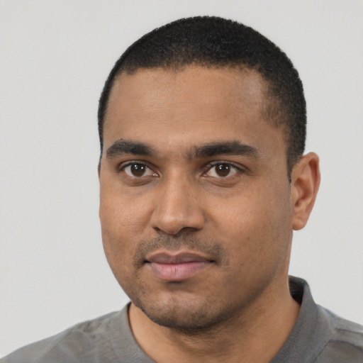 Neutral black young-adult male with short  black hair and brown eyes