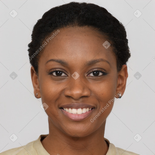 Joyful black young-adult female with short  black hair and brown eyes