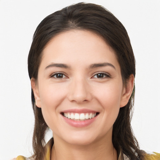 Joyful white young-adult female with long  brown hair and brown eyes