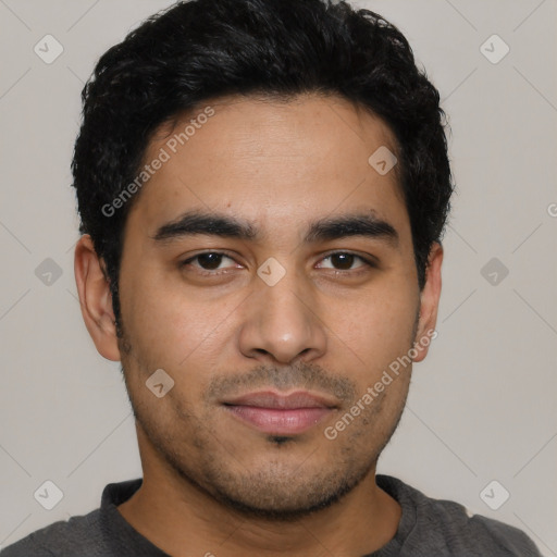 Joyful latino young-adult male with short  black hair and brown eyes