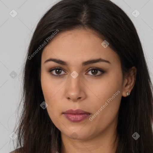 Joyful latino young-adult female with long  brown hair and brown eyes