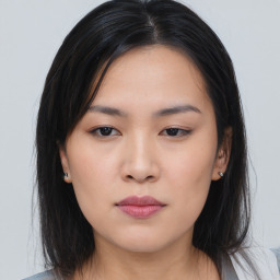 Neutral asian young-adult female with medium  black hair and brown eyes