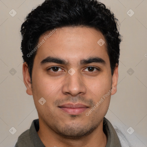 Joyful latino young-adult male with short  brown hair and brown eyes