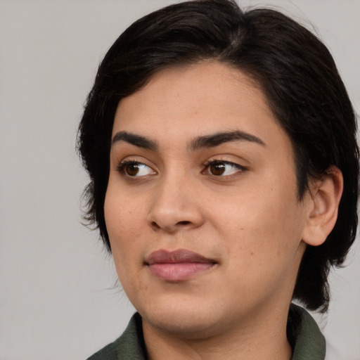 Joyful asian young-adult female with medium  black hair and brown eyes