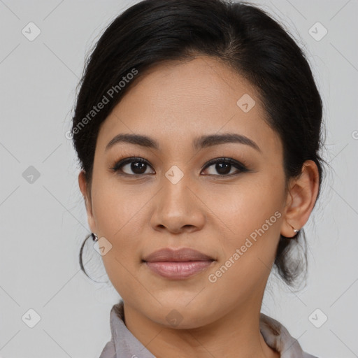 Joyful latino young-adult female with medium  brown hair and brown eyes