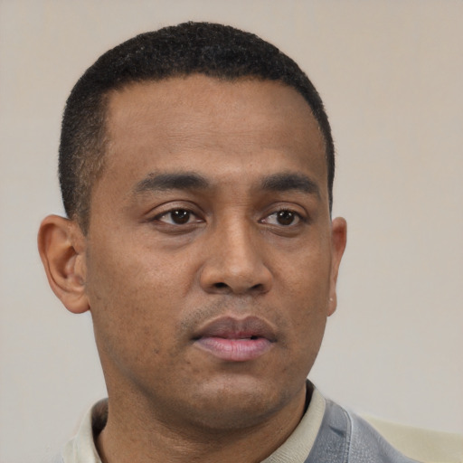 Neutral latino young-adult male with short  brown hair and brown eyes