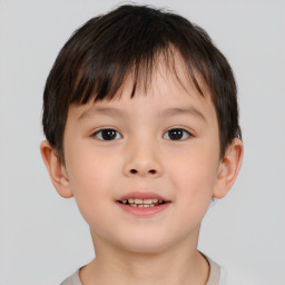 Joyful white child male with short  brown hair and brown eyes