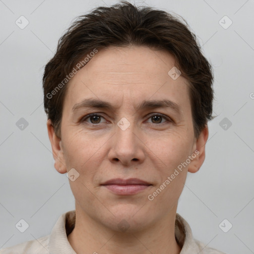 Joyful white adult female with short  brown hair and brown eyes