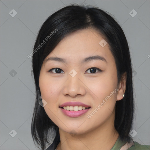 Joyful asian young-adult female with medium  black hair and brown eyes