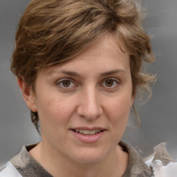 Joyful white adult female with medium  brown hair and grey eyes