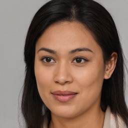 Joyful asian young-adult female with long  brown hair and brown eyes