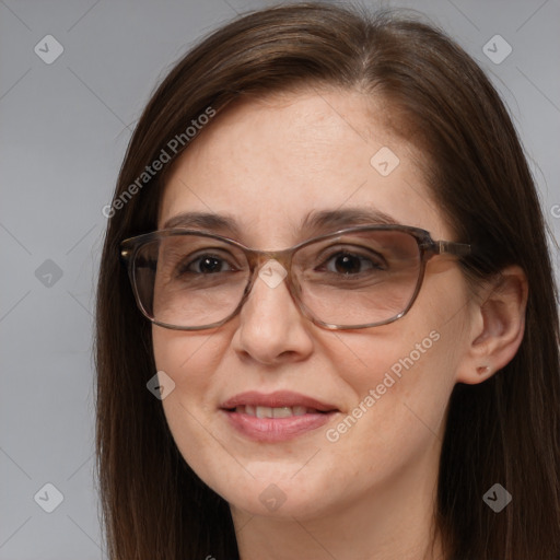 Joyful white adult female with long  brown hair and brown eyes