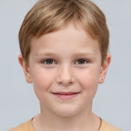 Joyful white child male with short  brown hair and grey eyes