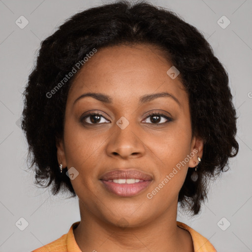 Joyful black young-adult female with long  brown hair and brown eyes