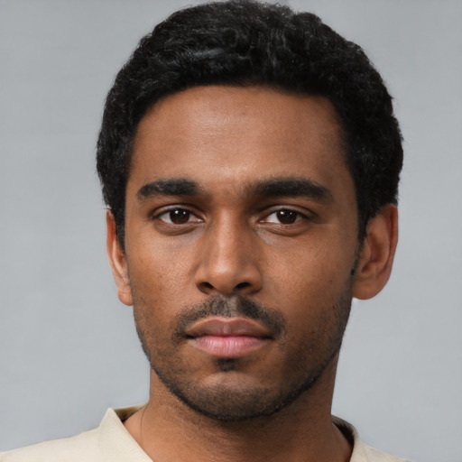 Neutral black young-adult male with short  black hair and brown eyes