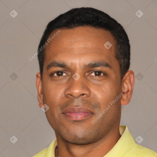 Joyful black young-adult male with short  black hair and brown eyes