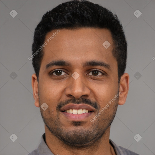 Joyful black young-adult male with short  black hair and brown eyes