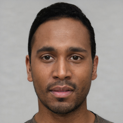 Neutral black young-adult male with short  black hair and brown eyes