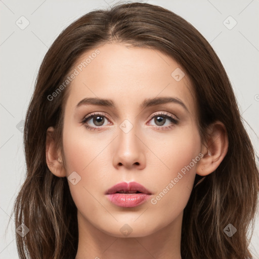 Neutral white young-adult female with long  brown hair and brown eyes