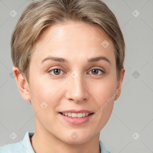 Joyful white young-adult female with short  brown hair and grey eyes