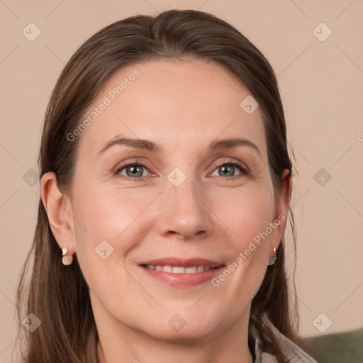 Joyful white adult female with medium  brown hair and grey eyes