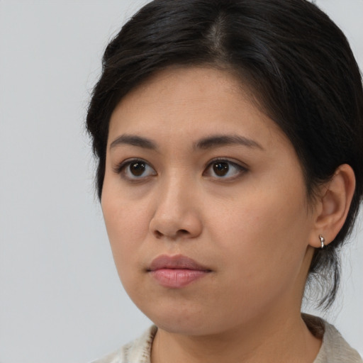 Neutral asian young-adult female with medium  brown hair and brown eyes