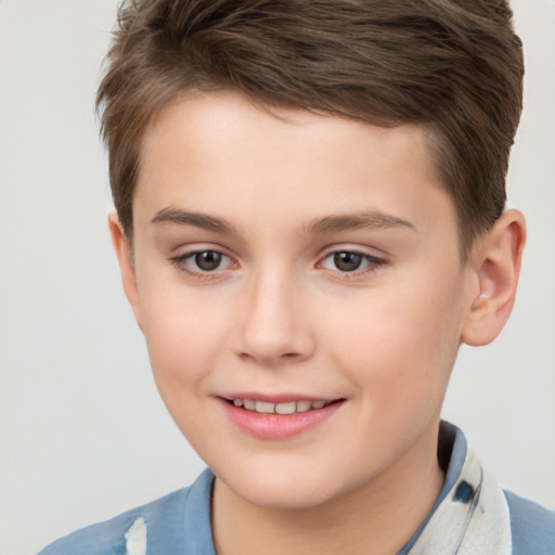 Joyful white child male with short  brown hair and brown eyes