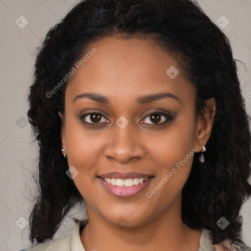 Joyful black young-adult female with long  black hair and brown eyes