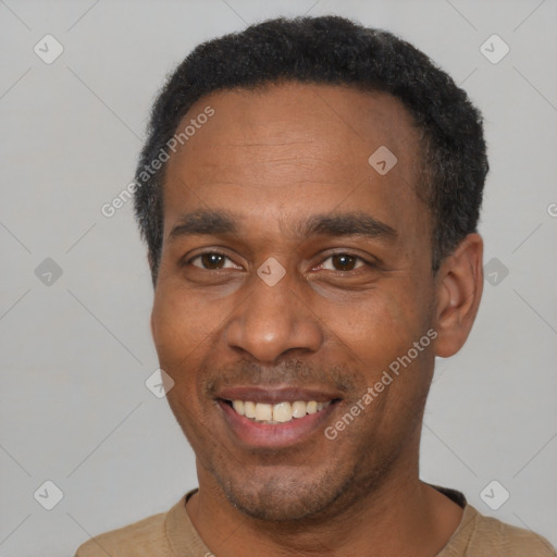 Joyful latino adult male with short  black hair and brown eyes