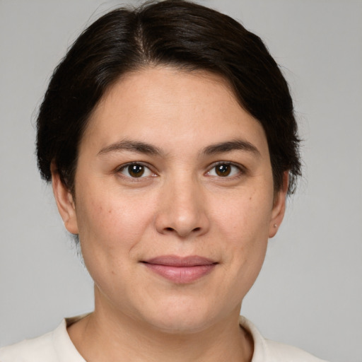 Joyful white young-adult female with medium  brown hair and brown eyes