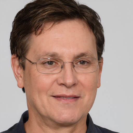 Joyful white middle-aged male with short  brown hair and grey eyes