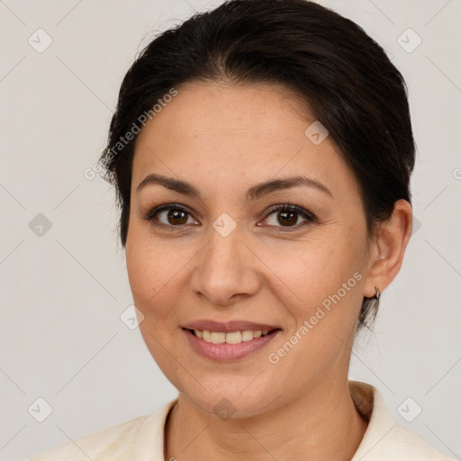 Joyful white adult female with medium  brown hair and brown eyes