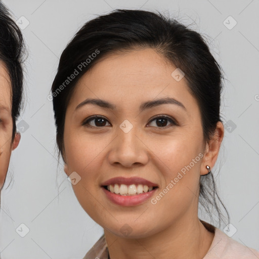 Joyful asian young-adult female with medium  brown hair and brown eyes