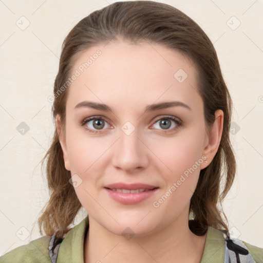 Joyful white young-adult female with medium  brown hair and green eyes