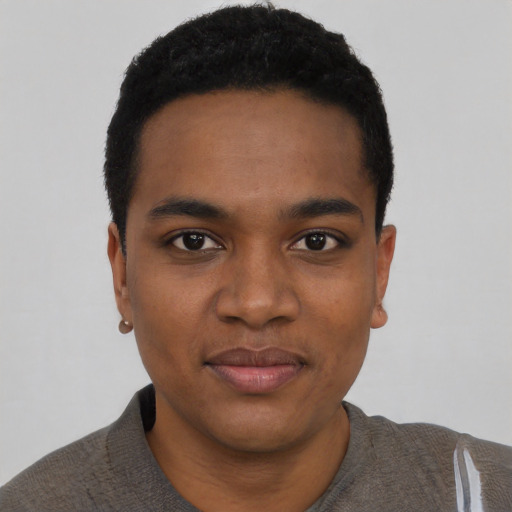 Joyful black young-adult male with short  black hair and brown eyes