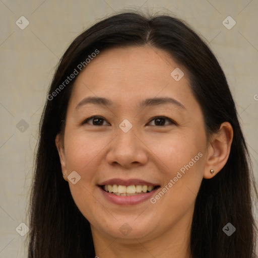 Joyful white adult female with long  brown hair and brown eyes